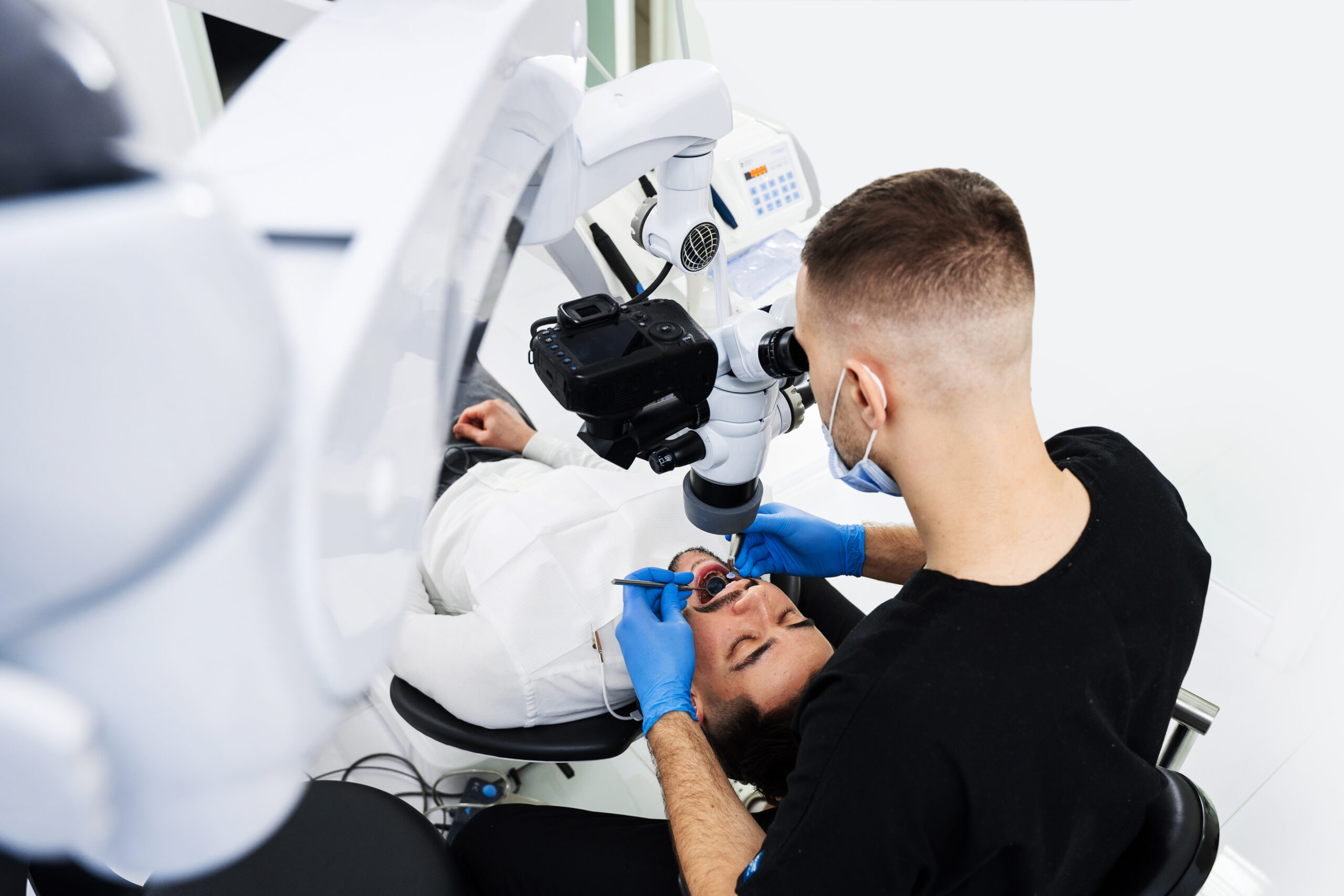 Digital microscope diagnostic by dentist. Polishing teeth with digital microscope in stomatology clinic