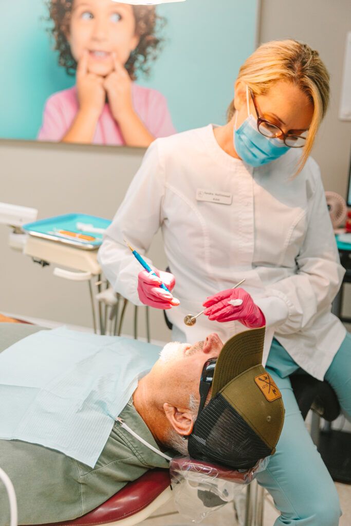 Cedar Pearl Dental team member examining a patient in Crestview FL