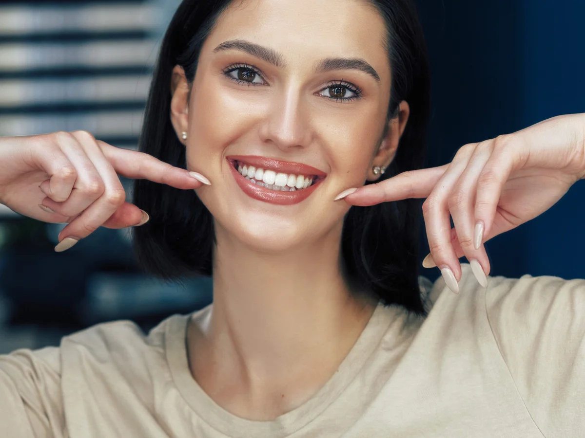 Woman smiling and showing healthy white teeth at Cedar Pearl Dental Crestview