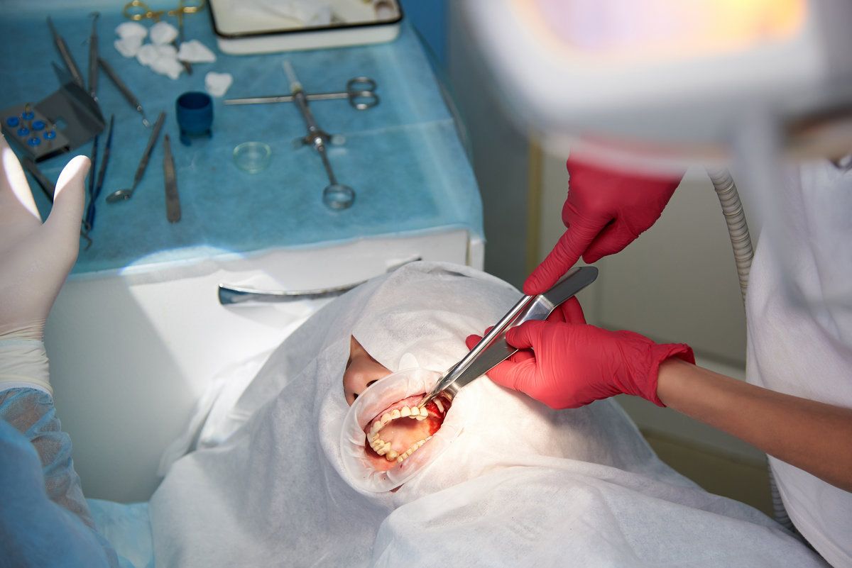 Dental surgery in progress with patient