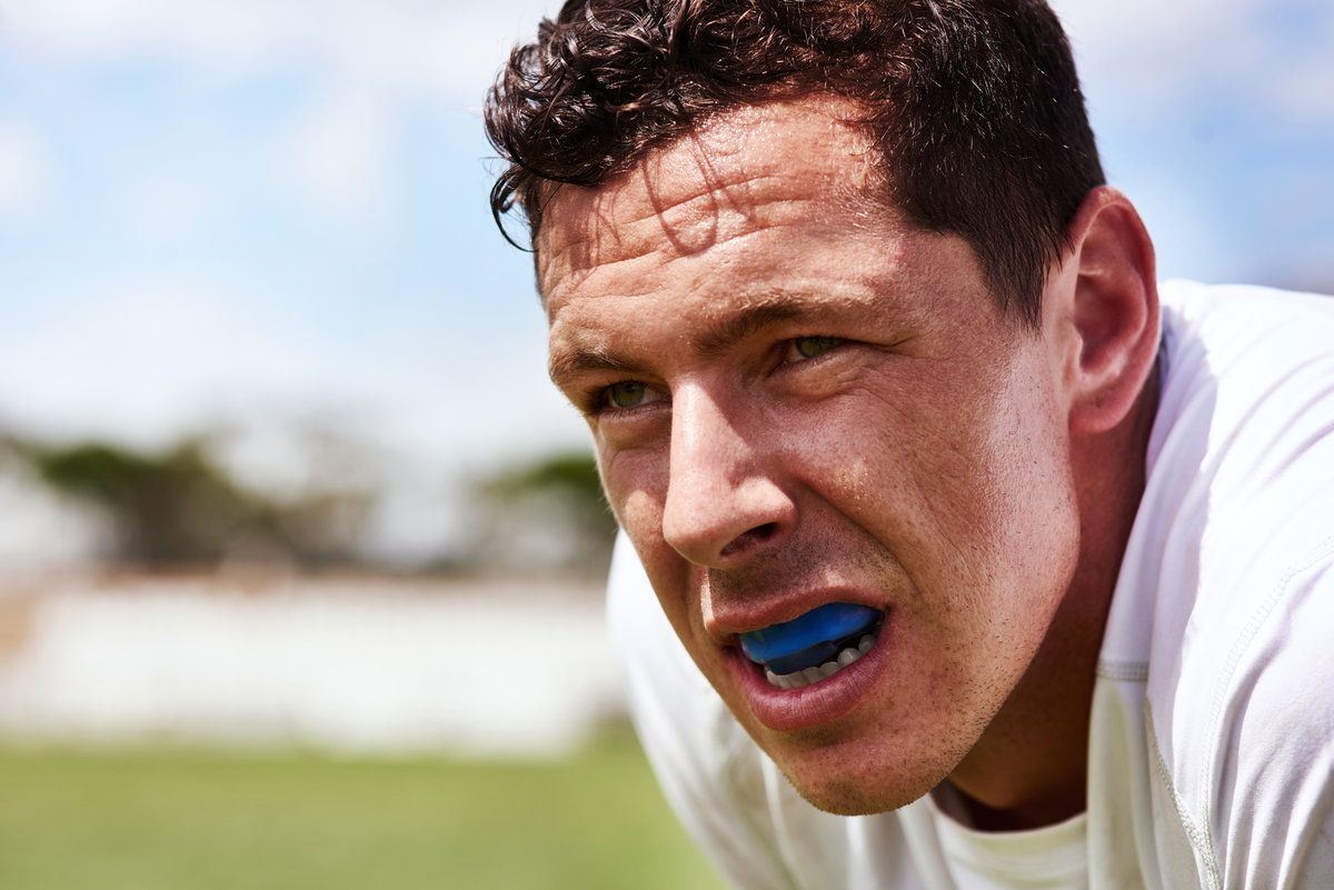 Athlete with mouthguard, focused expression